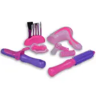 Set di bellezza rosa a 7 pezzi con pennelli per trucco, asciugacapelli e accessori.
