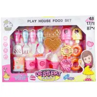 Set di dolci per festa con ciambelle, waffle e accessori