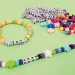 PlayBox: Confezione di perline infilabili da 1000 pezzi con lettere mini