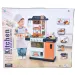 Set cucina giocattolo blu e bianco con cibi che cambiano colore, rubinetto con flusso dacqua e accessori.